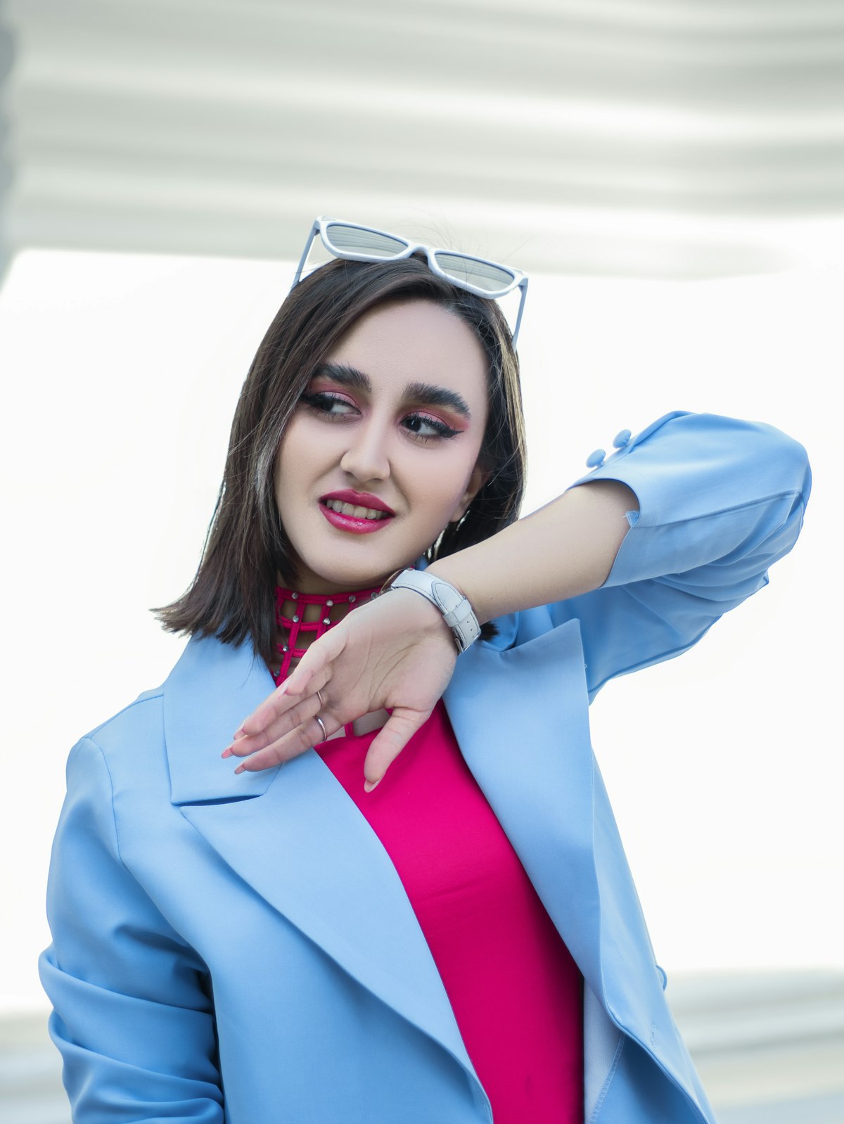Portrait in a pale blue coat against bright fog